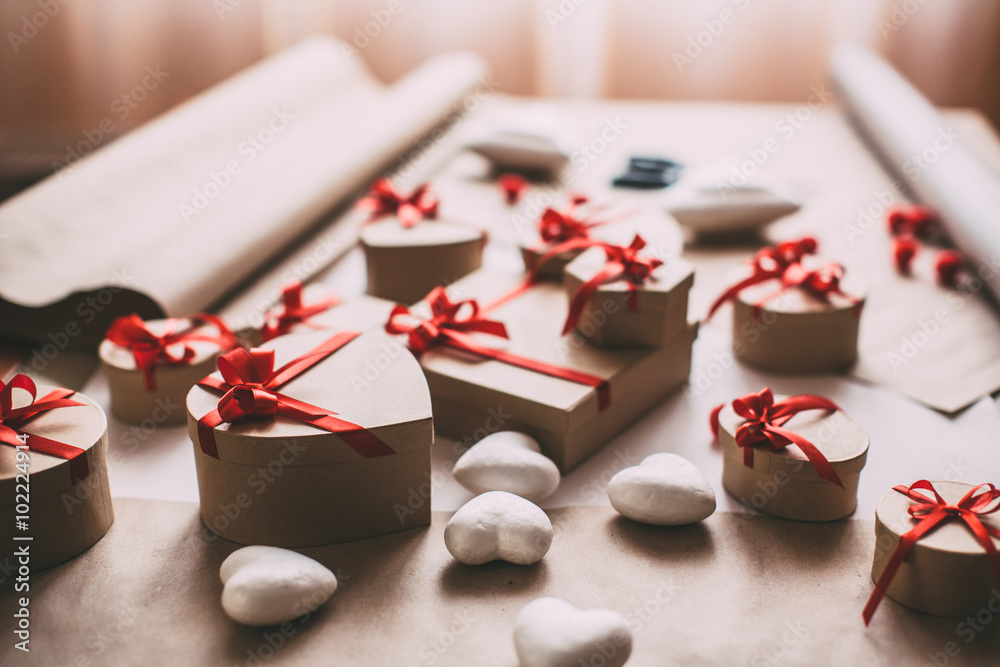 Packing stylish gifts with red ribbon. Packing stylish gifts with red ribbon.