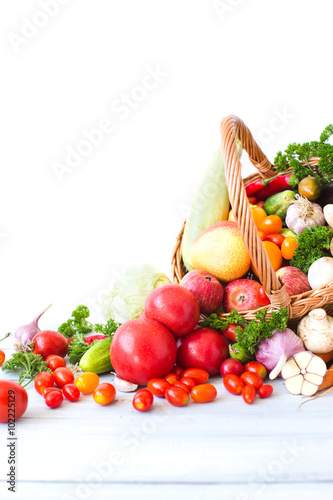 Fototapeta Naklejka Na Ścianę i Meble -  Fresh vegetables and fruits in a basket isolated on white background.