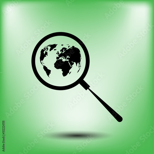 Analyzing the world. Magnifier glass with globe