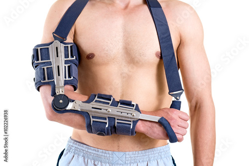 Shirtless Man with Arm in Articulated Sling.