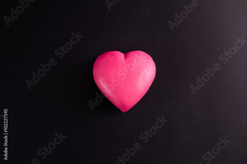 pink heart on a black background
