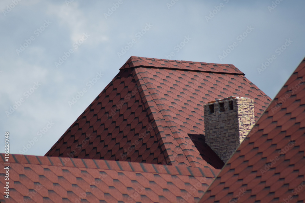 Decorative metal tile on a roof