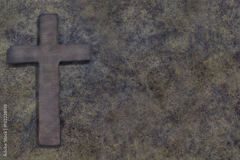 Wooden cross on old wooden board