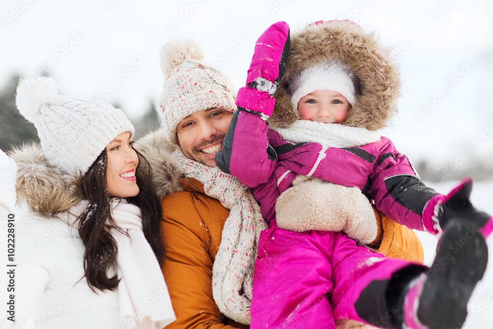 happy family with child in winter clothes outdoors happy family with child in winter clothes outdoors