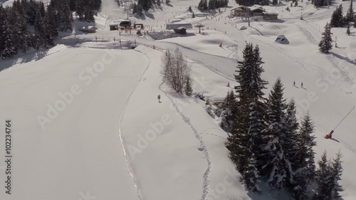 Aerial shot of people skiing in a french ski resort in the Alps
 photo