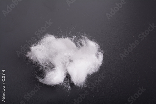 Cotton white ball against a dark background