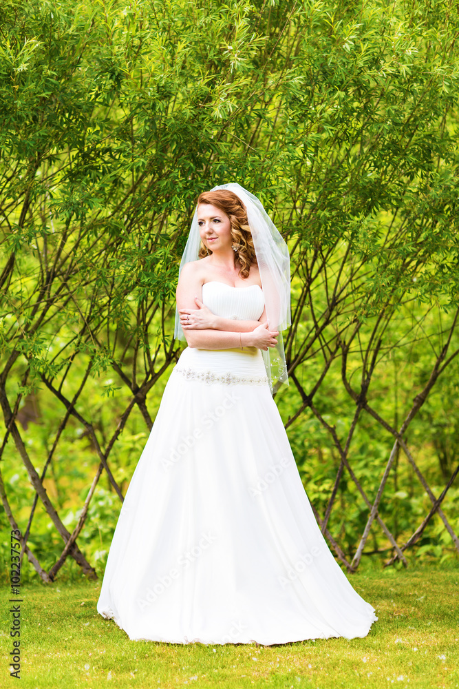 Lovely bride outdoors in a park