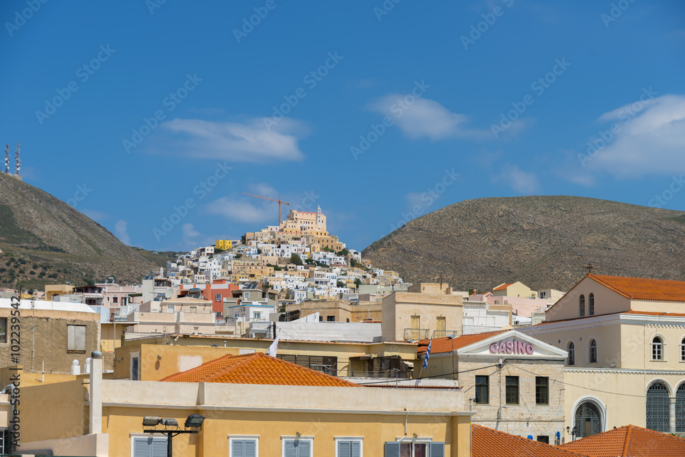 Traditional buildings on a sunny day in Syros island, Greece.