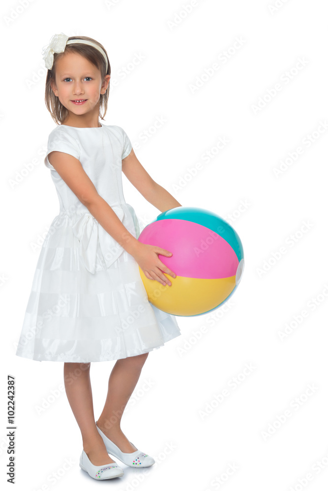 Cute little girl in fancy white dress holding a big striped beach ball - Isolated on white background Cute little girl in fancy white dress holding a big striped beach ball - Isolated on white background