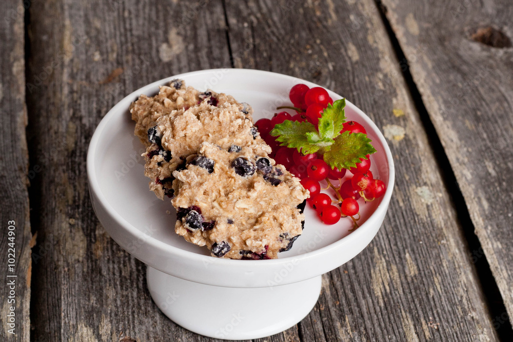 Oatmeal cookies with milk and fresh berries, horizontal Oatmeal cookies with milk and fresh berries, horizontal