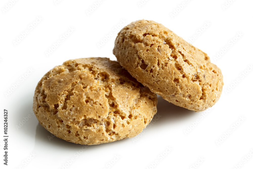 Detail of two whole Italian amaretti biscuits isolated on white