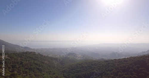 4K Aerial, Flying in the mountains with view on La Capellania, Andalusia, Spain - straight out of the camera, no recompression. photo