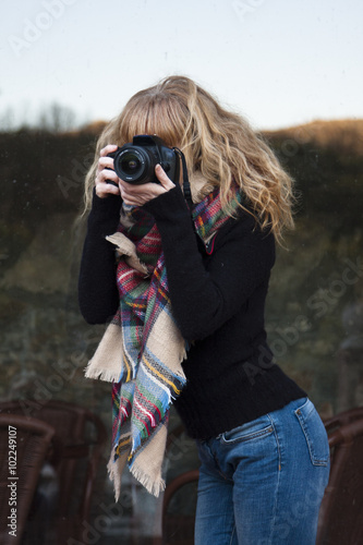 woman with photo camera outdoors photo
