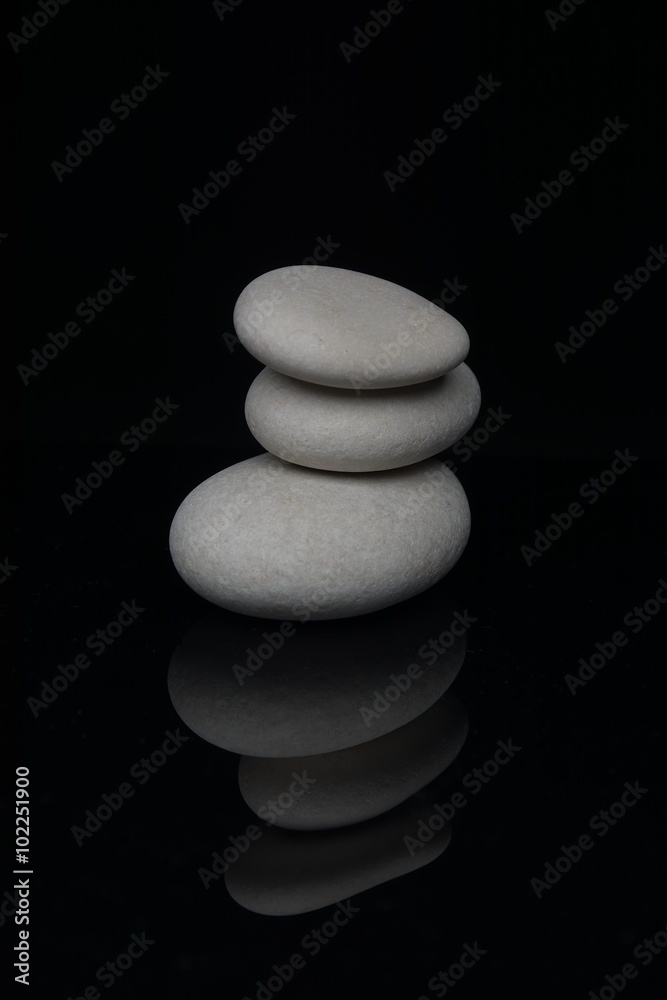 Spa Stones. White shiny zen stones over white background Spa Stones. White shiny zen stones over white background