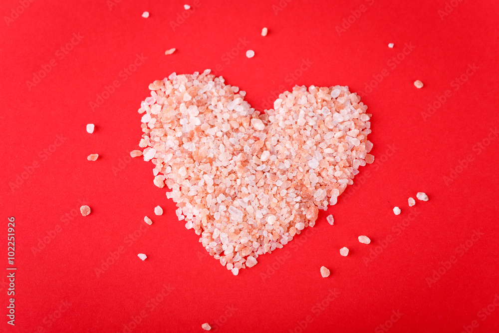Valentines Day card - heart of small colored pebbles on red background