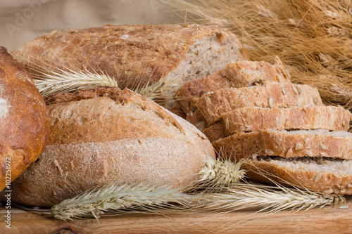 f bread with cereals on a fabric background brown color. photo