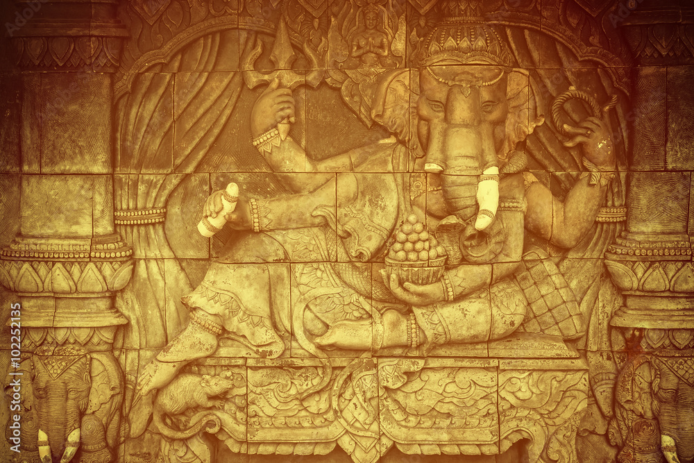 Vintage of Ganesha god statue in public temple in Thailand, Ganesha God is elephant God in Hindu religion.