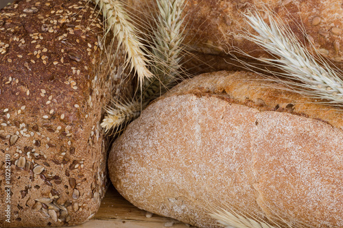 f bread with cereals on a fabric background brown color. photo