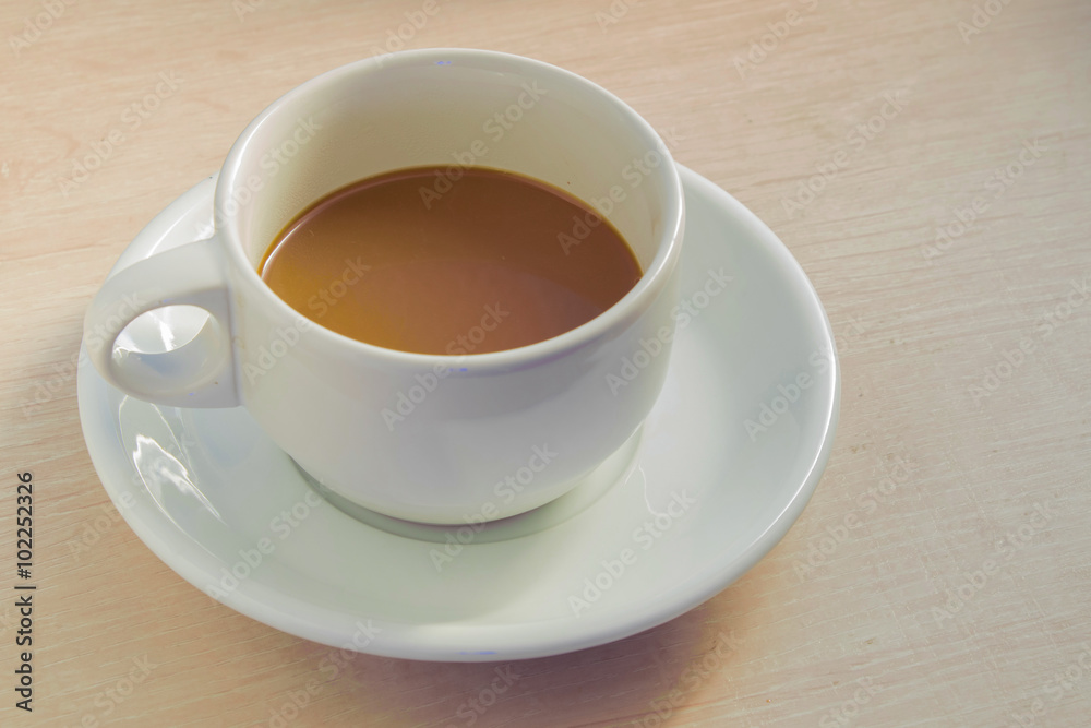 Cup of coffee on old white wooden table. Cup of coffee on old white wooden table.