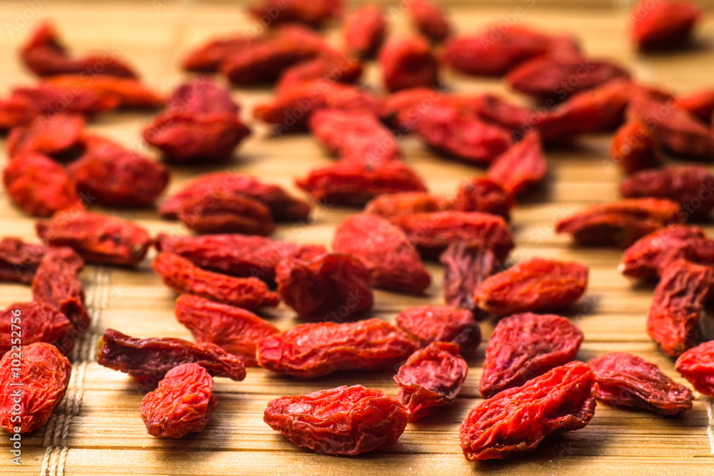 Dried goji berries on wood. Healthy food and lifestyle Dried goji berries on wood. Healthy food and lifestyle