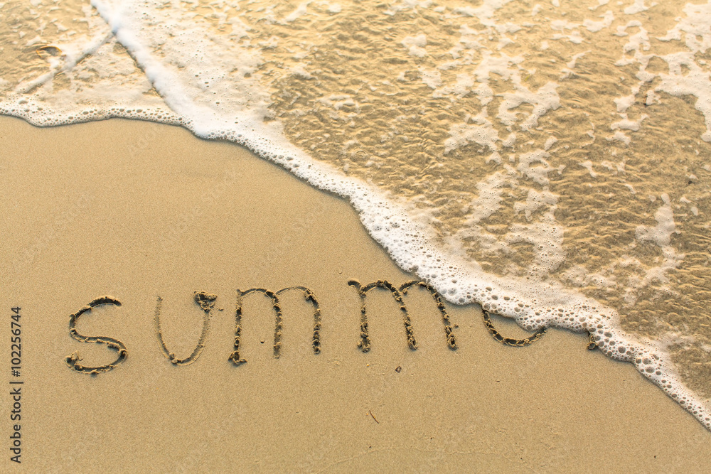 Fototapeta premium Summer - inscription on sand beach with the soft wave.