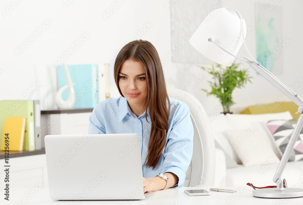 A beautiful successful woman working at the modern office A beautiful successful woman working at the modern office