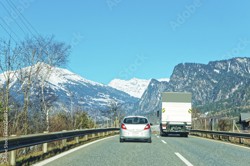 View of road with car and truck in winter Switzerland © Roman Babakin