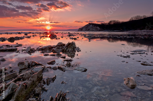 Sea rocks at sunset. Stunning sunset view at the Black sea coast, Bulgaria