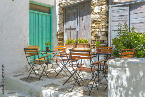 Traditional greek cafe in the narrow streets of Mykonos  Greece.