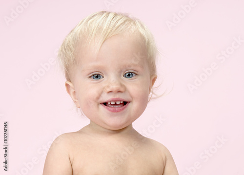 little child baby portrait on pink background photo