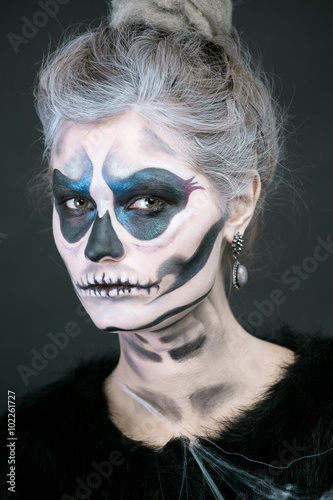 girl in the image of a skeleton on a black background