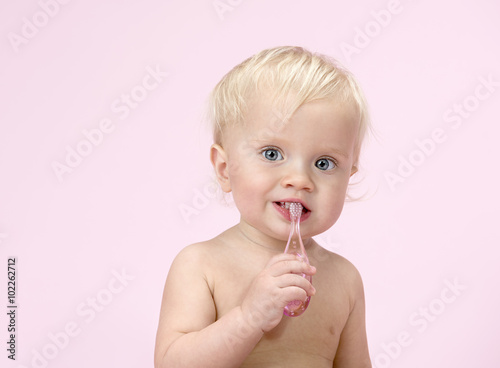 little child baby brushink teeth