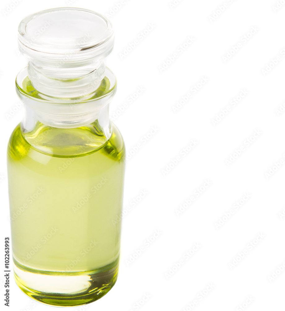 Grapeseed oil in vial glass over wooden background Grapeseed oil in vial glass over wooden background