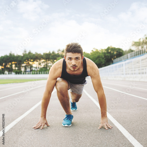 Male athlete on starting position