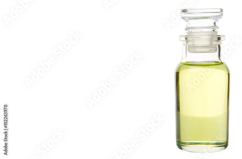 Grapeseed oil in vial glass over wooden background