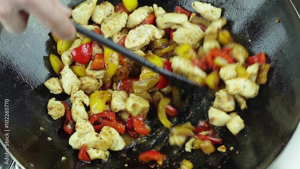 cooking chicken curry with fried vegetables