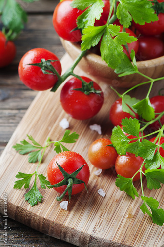 Fresh red tomato with green parsley