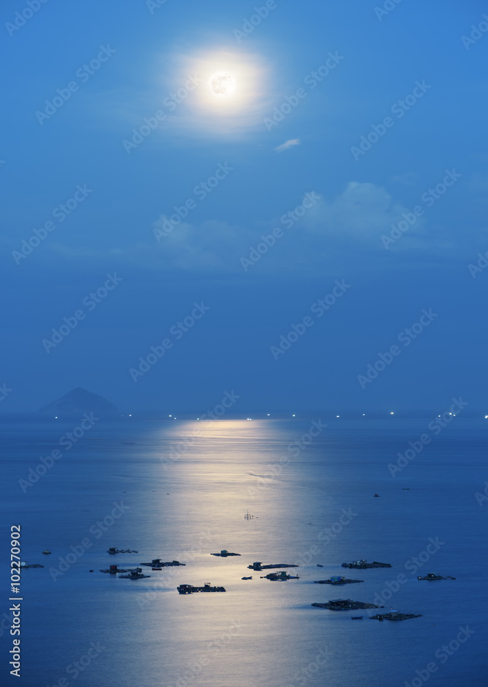 Full moon reflected in water of Nha Trang Bay in Vietnam Full moon reflected in water of Nha Trang Bay in Vietnam