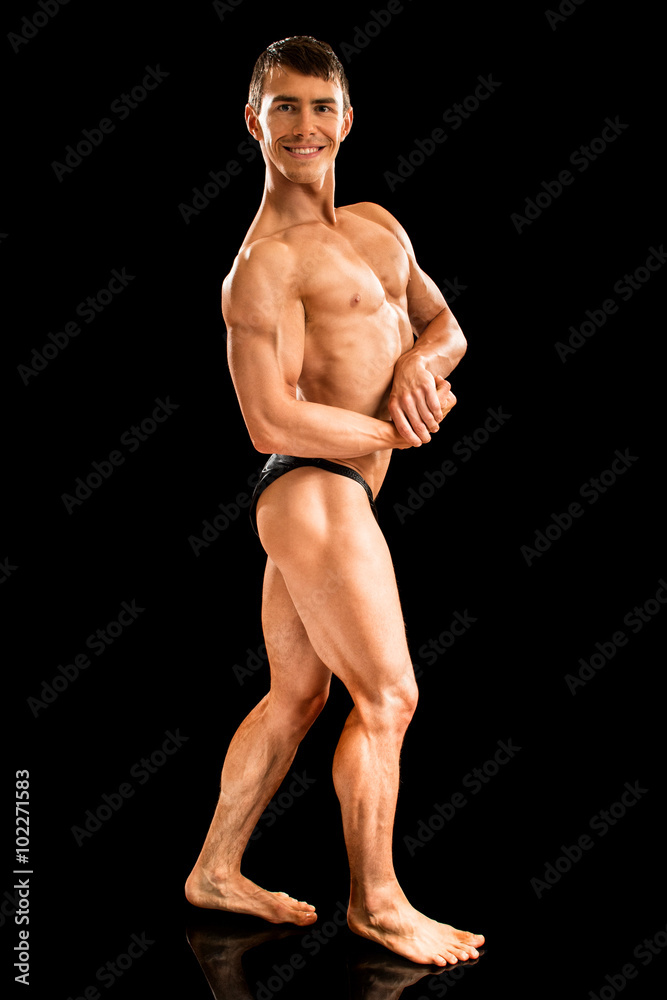 Bodybuilder Posing on Black Bodybuilder Posing on Black