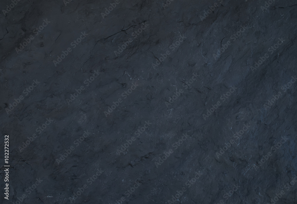 Black natural slate stone texture or background.