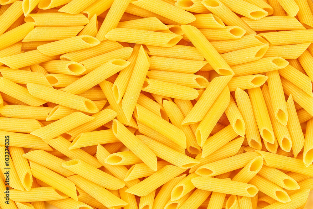 Italian Penne Rigate Macaroni Pasta raw food background or textu Italian Penne Rigate Macaroni Pasta raw food background or textu