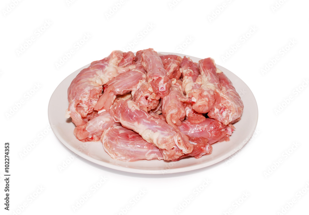 Chicken offal Raw fresh necks on a dish against white background