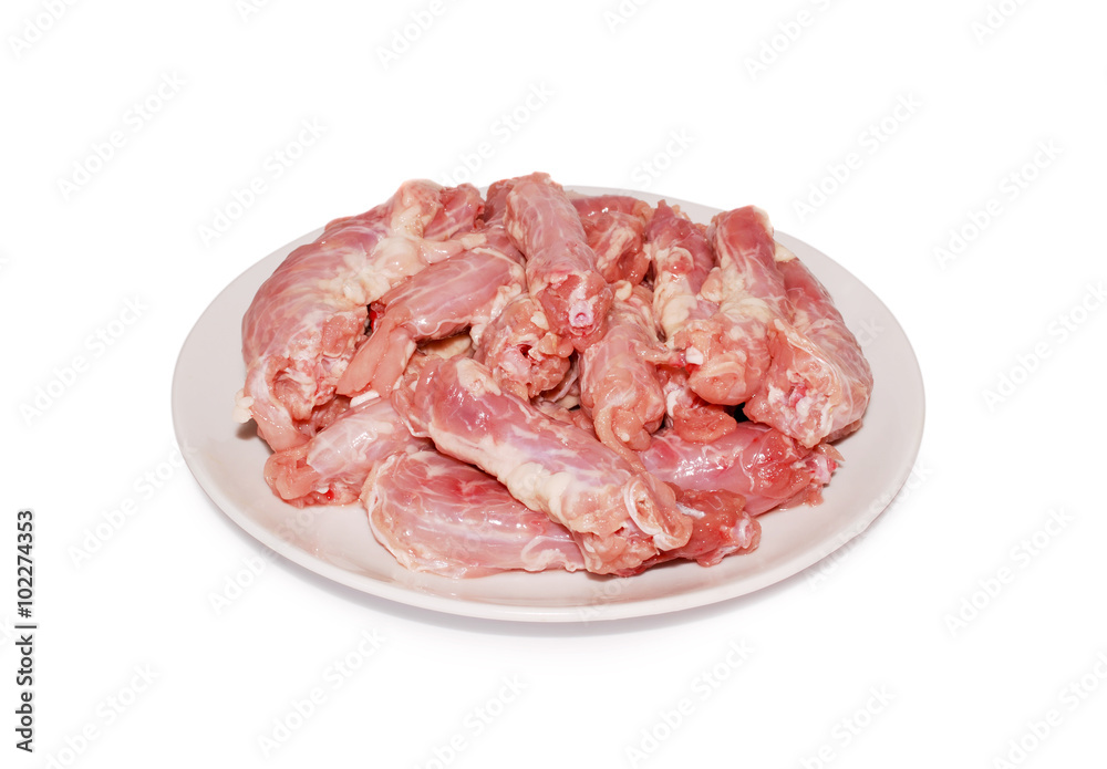 Chicken offal Raw fresh necks on a dish against white background Chicken offal Raw fresh necks on a dish against white background