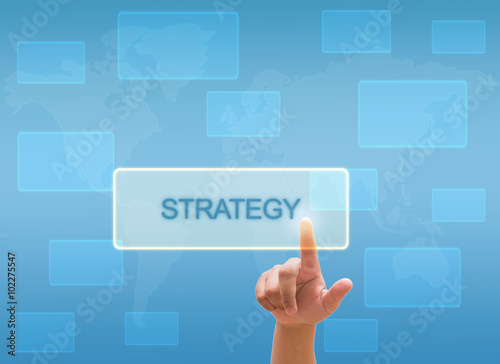 hand touching " STRATEGY " on virtual screen interface