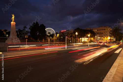France, Nice, 2016.01.21: Monument Centennial, Promenade des Anglais, traffic, long exposure, Great wheel on the place Massena (Massena square), 