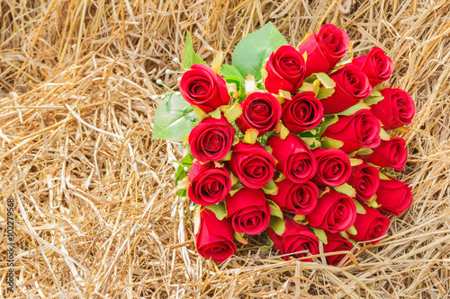 A bouquet of artificial roses on the Hay, vintage style, the con