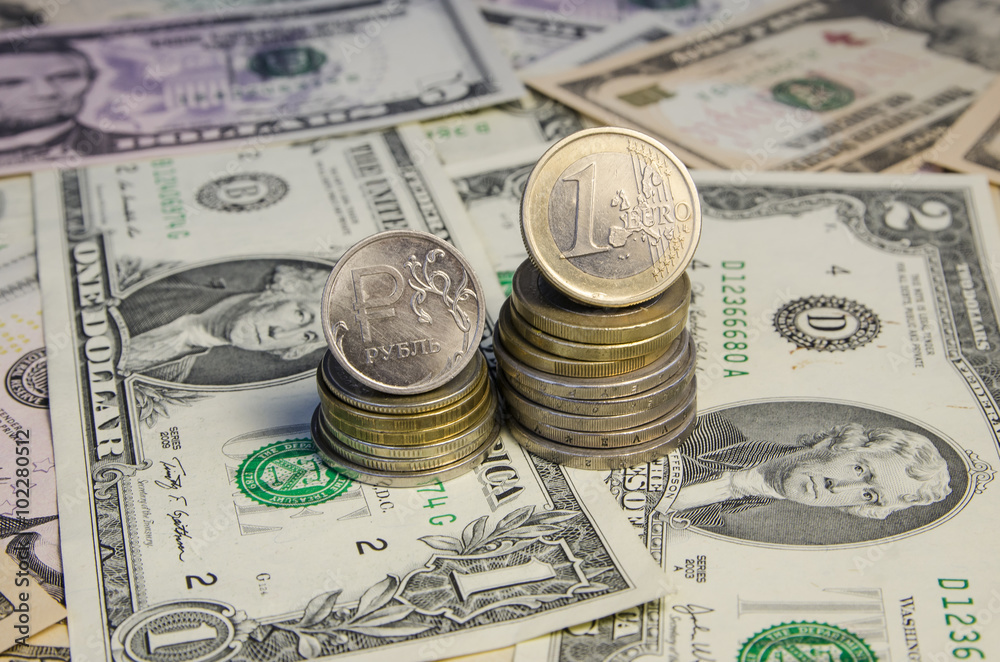 Russian roubles and Euro coins on banknotes Russian roubles and Euro coins on banknotes