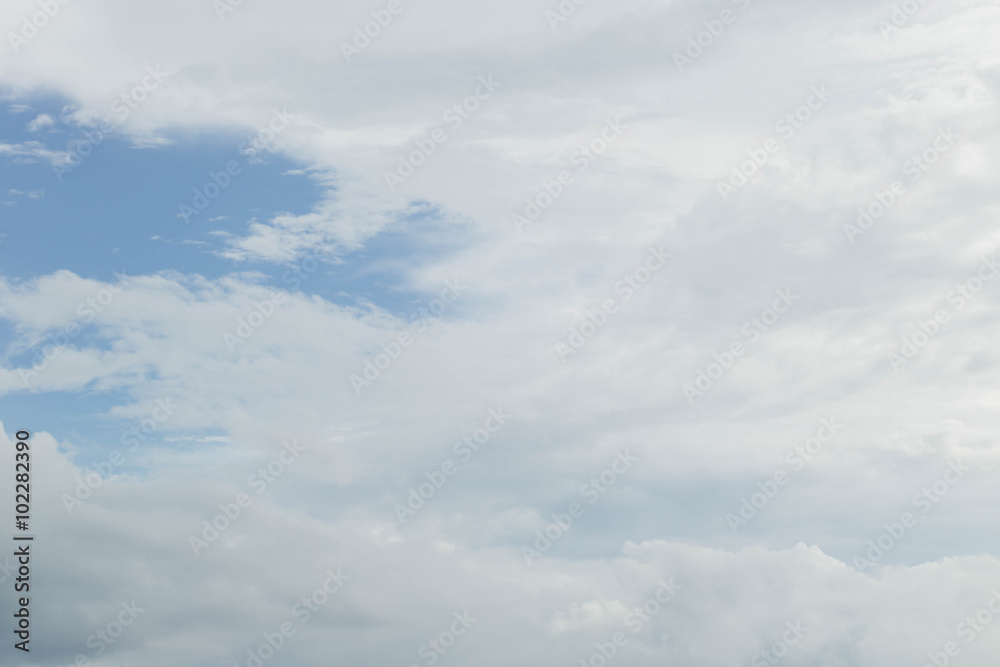 Light blue sky with clouds, may be used as background Light blue sky with clouds, may be used as background