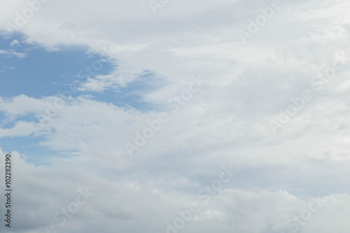 Light blue sky with clouds, may be used as background