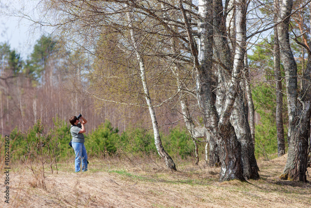 woman photographing nature